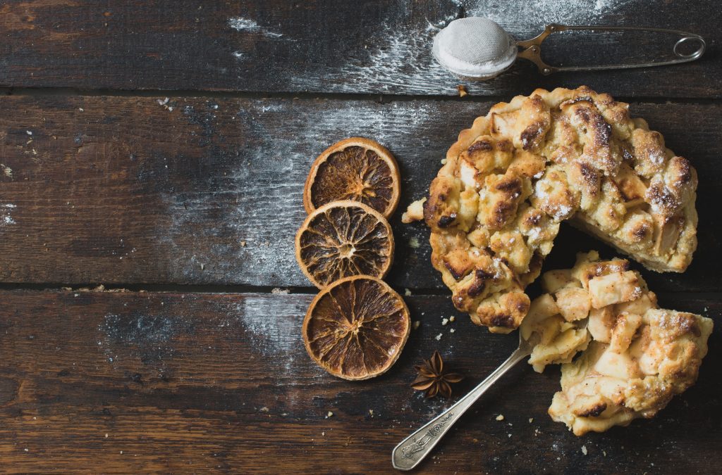 Apple pie on wooden background